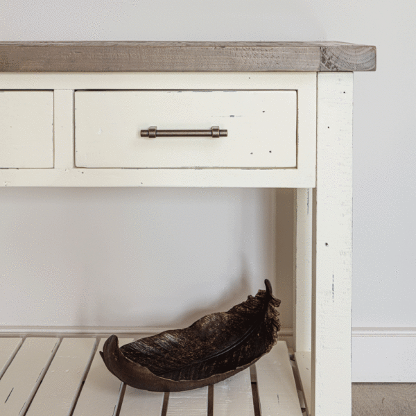 view of right half of modern farmhouse console table with leaf bowl on bottom rack